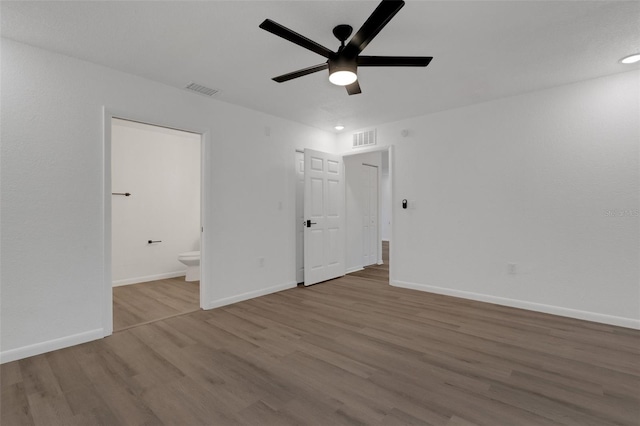 spare room featuring light hardwood / wood-style flooring and ceiling fan