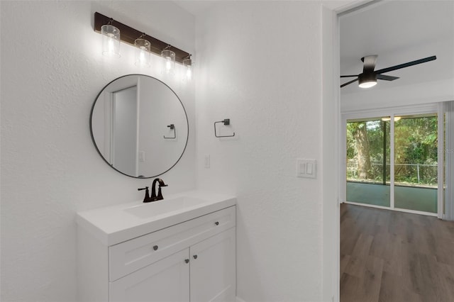 bathroom featuring vanity, hardwood / wood-style floors, and ceiling fan