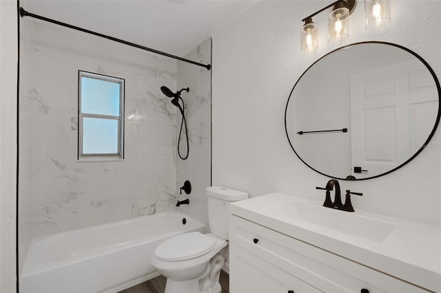 full bathroom with vanity, toilet, and tiled shower / bath combo