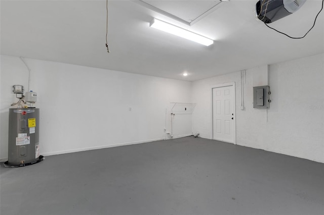 garage featuring a garage door opener, electric panel, and water heater