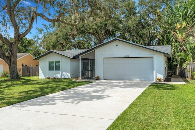 ranch-style house with a front yard and a garage