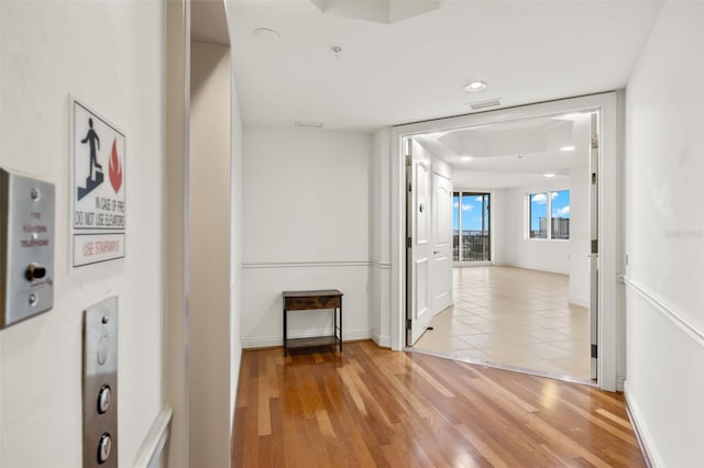 hall with light hardwood / wood-style flooring