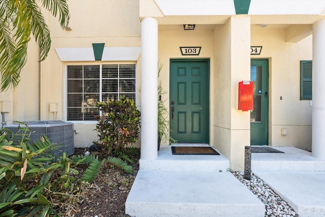 doorway to property featuring central AC