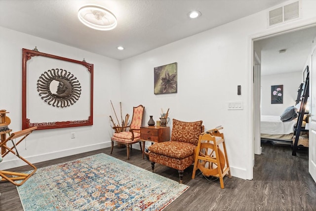 living area with dark hardwood / wood-style flooring