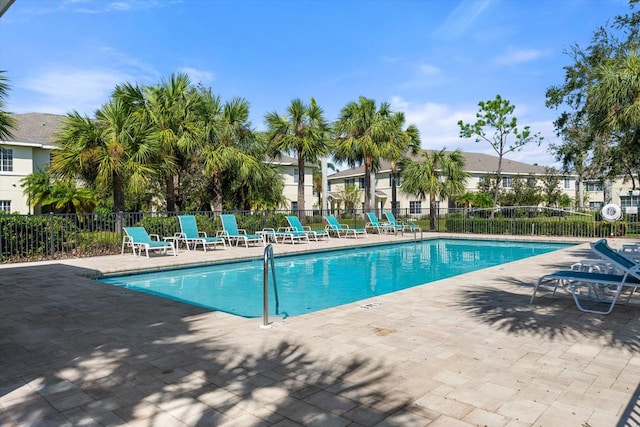 view of swimming pool with a patio area