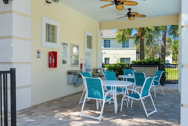 view of patio featuring ceiling fan