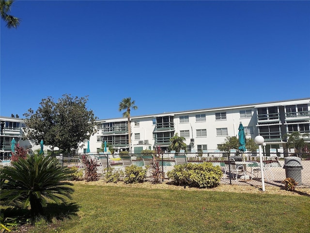 view of building exterior featuring a pool