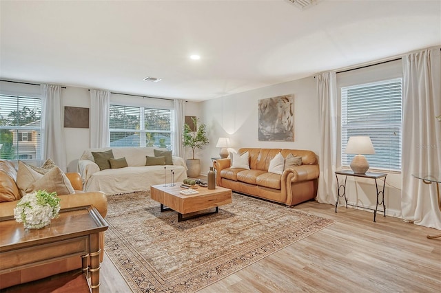 living room with light hardwood / wood-style flooring