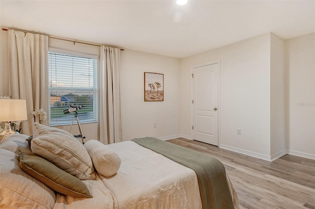 bedroom with light wood-type flooring