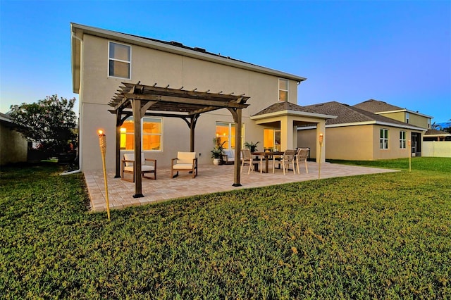 rear view of house with a yard, a patio, and a pergola