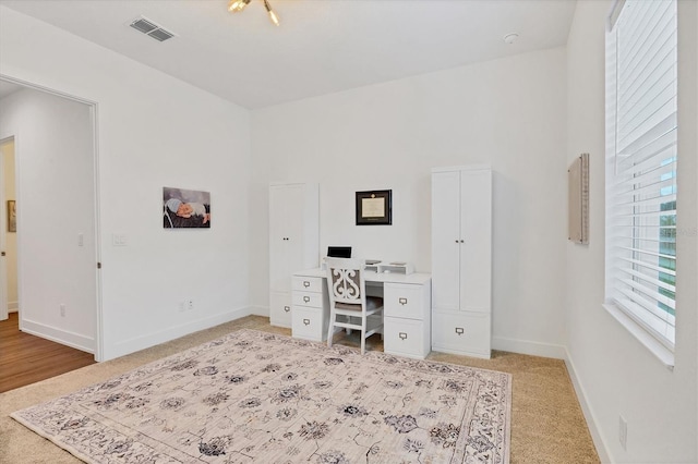 home office featuring light colored carpet