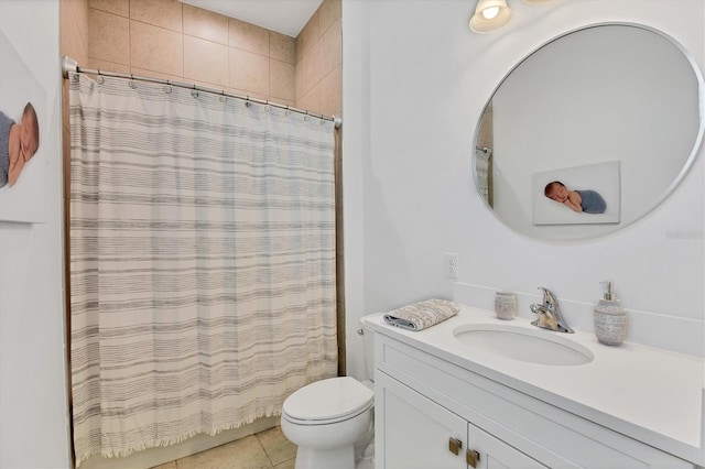 bathroom featuring vanity, toilet, walk in shower, and tile patterned flooring