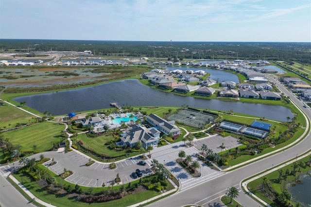 drone / aerial view featuring a water view and a residential view