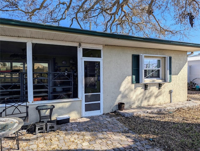 property entrance featuring a patio area