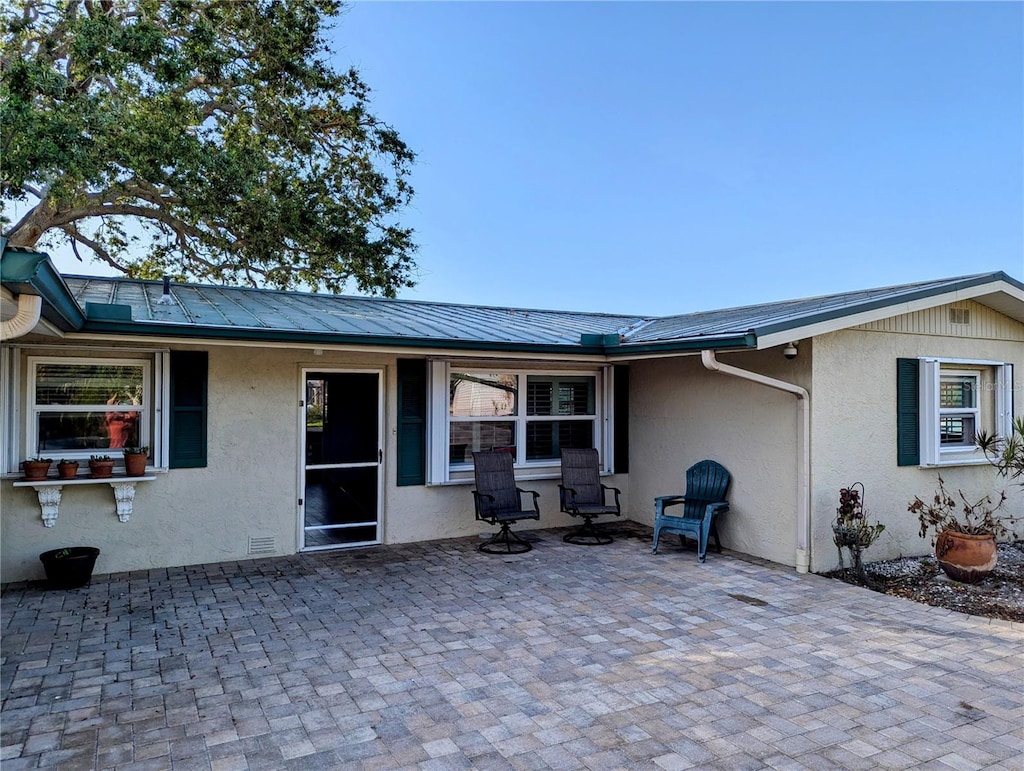 back of property with a patio area