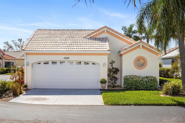 mediterranean / spanish-style house with a garage