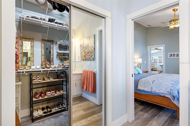 bedroom with ceiling fan and hardwood / wood-style floors