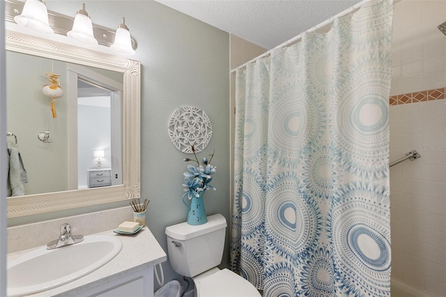 bathroom featuring vanity, toilet, a textured ceiling, and a shower with shower curtain