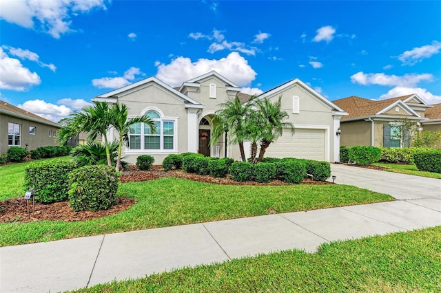 view of front facade featuring a garage and a front yard