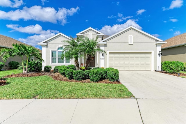 view of front facade featuring a front lawn and a garage