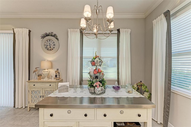 tiled dining space with crown molding and a chandelier