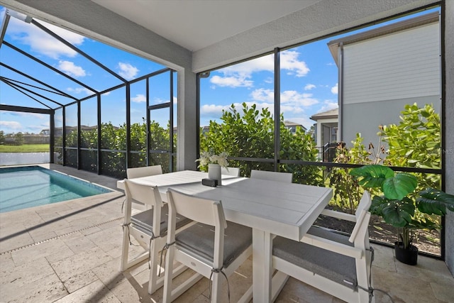 view of pool featuring a patio area and glass enclosure