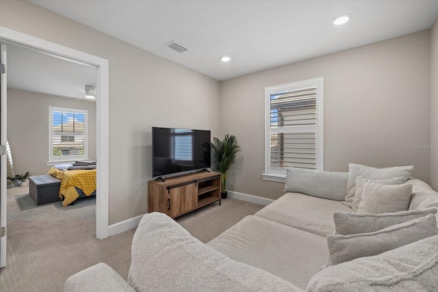 living room featuring light carpet