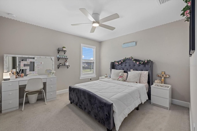 bedroom with light carpet and ceiling fan