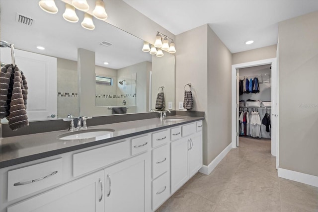 bathroom with vanity, tile patterned floors, and an enclosed shower