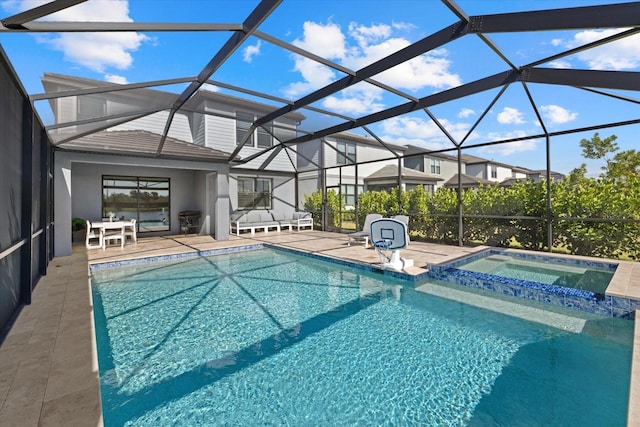 view of swimming pool with a patio, a lanai, and an in ground hot tub