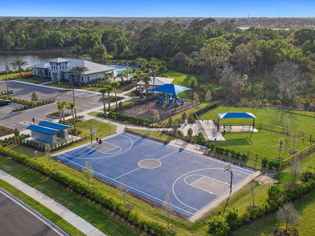 view of sport court featuring a gazebo, a yard, and a water view