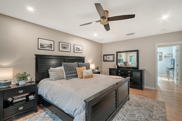 bedroom featuring ceiling fan and light hardwood / wood-style flooring