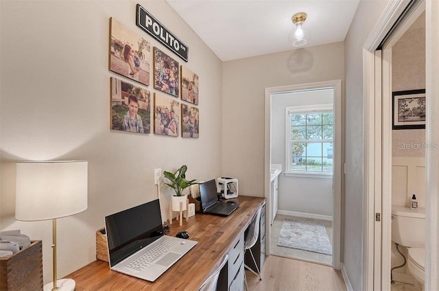 home office with light wood-type flooring