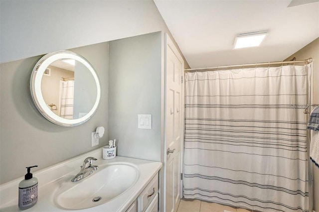 bathroom featuring vanity, curtained shower, and tile patterned floors