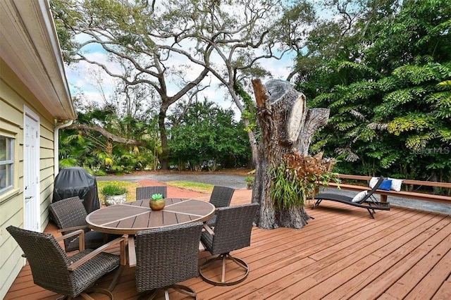 wooden terrace with area for grilling