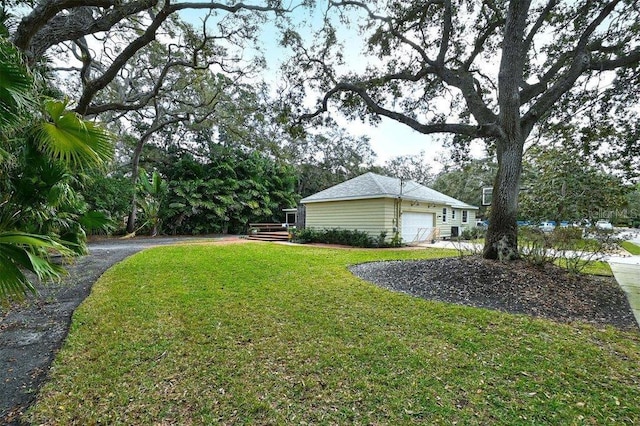 view of yard featuring a garage