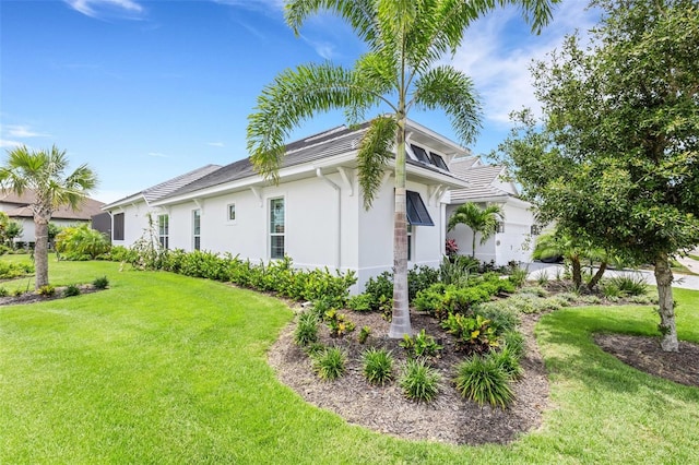 view of side of property with a yard