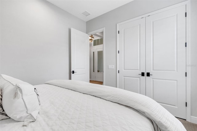 bedroom with a closet and carpet floors