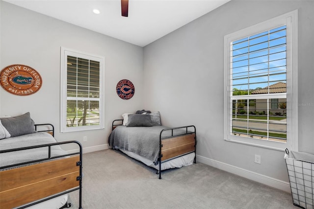 carpeted bedroom with ceiling fan