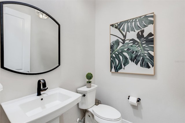 bathroom featuring sink and toilet