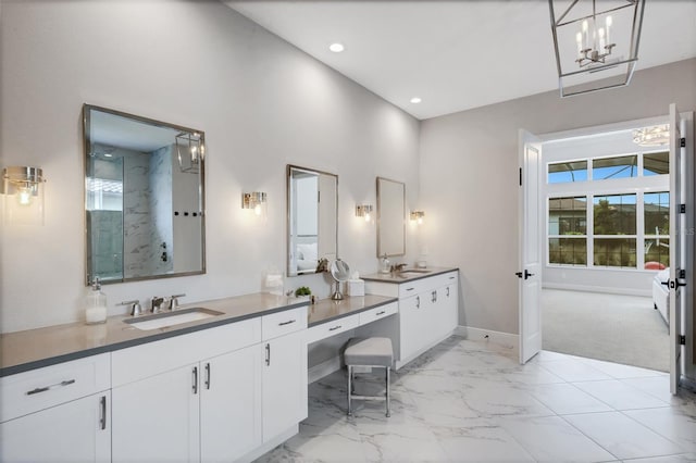 bathroom with vanity and a tile shower