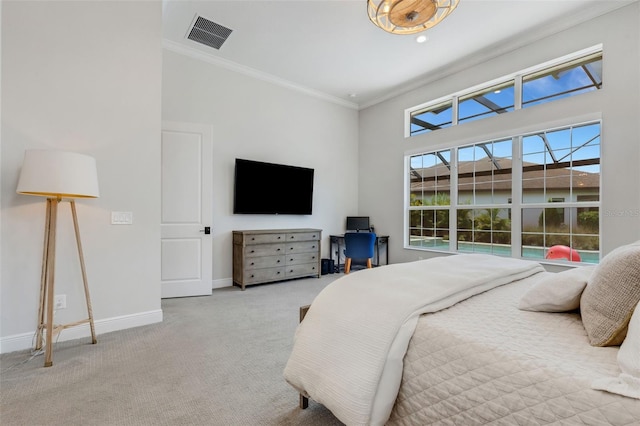 carpeted bedroom featuring crown molding