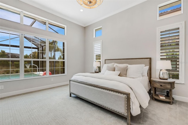 carpeted bedroom with crown molding, multiple windows, and a high ceiling