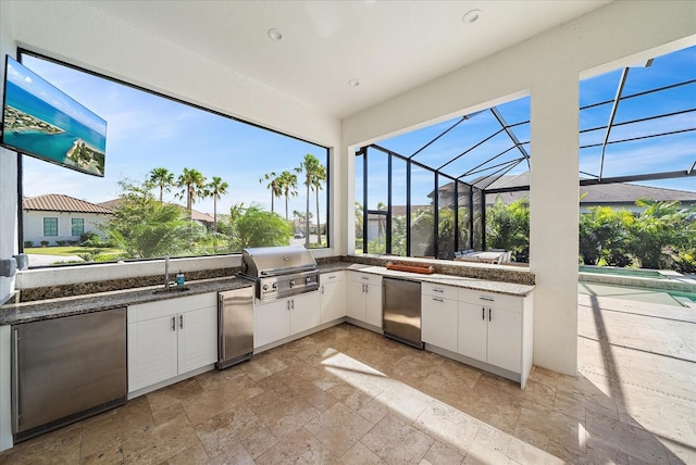 view of patio / terrace featuring a pool, a grill, exterior kitchen, sink, and glass enclosure