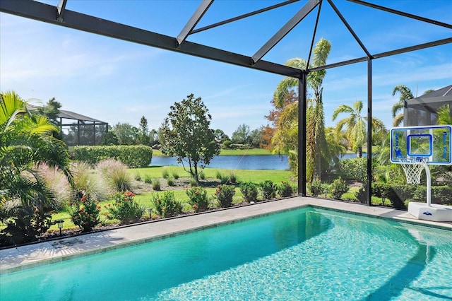 view of swimming pool featuring a water view and glass enclosure