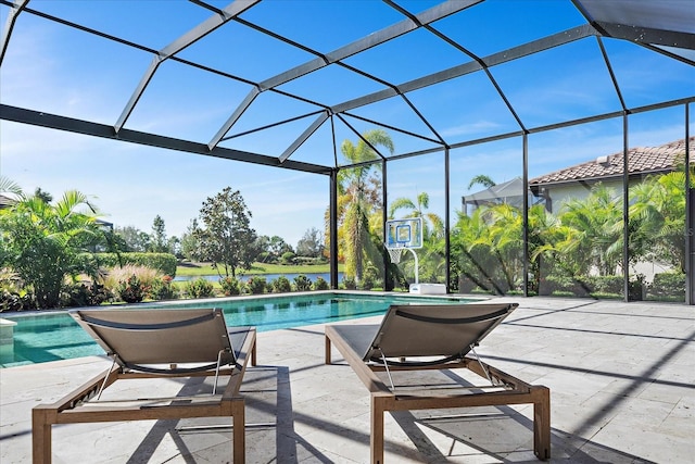 view of pool featuring a patio and glass enclosure