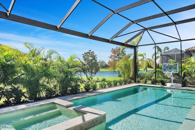 view of swimming pool with an in ground hot tub, a water view, and glass enclosure