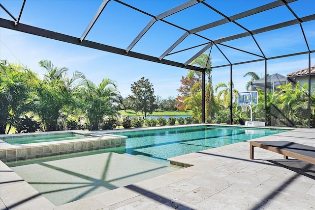 view of pool featuring a patio area, an in ground hot tub, and glass enclosure