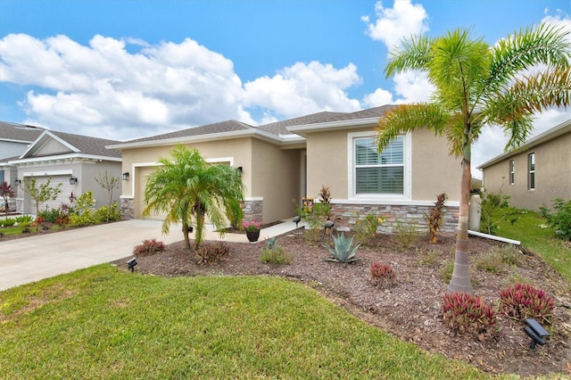 view of front of house with a front lawn and a garage