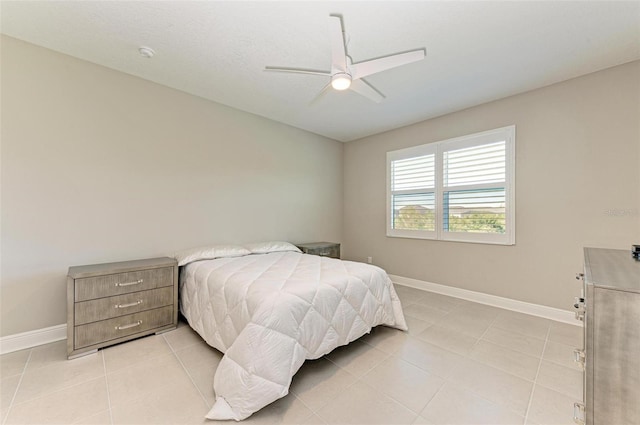 tiled bedroom with ceiling fan